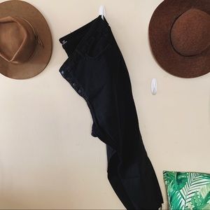 Black button fly skinny jeans